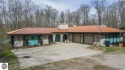 This unique 3900 sq foot resort- like residence is located on a for sale in Bellaire Michigan Antrim County County on GolfHomes.com
