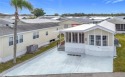 CHARMING MOBILE HOME IN ACTIVE 55+ COMMUNITY! Pride of ownership for sale in Bradenton Florida Manatee County County on GolfHomes.com