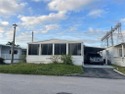 Huge 3/2 double wide with carport - shed - screened in porch for sale in Fort Lauderdale Florida Broward County County on GolfHomes.com