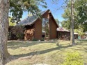 Opportunity awaits! Gorgeous log home living on a quiet street for sale in Ozawkie Kansas Jefferson County County on GolfHomes.com