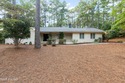 Tucked away among the lovely trees, this brick ranch is nestled for sale in Southern Pines North Carolina Moore County County on GolfHomes.com