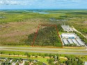 Almost 10 acres of agricultural land features prime road footage for sale in Naples Florida Collier County County on GolfHomes.com
