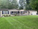 You'll enjoy the quality, 6' walls and workmanship of the lovely for sale in Lincoln Michigan Alcona County County on GolfHomes.com