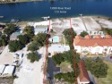 LARGE 1.72 ACRE WATERFRONT ESTATE ON PERDIDO KEY. This for sale in Pensacola Florida Escambia County County on GolfHomes.com