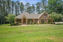 Custom home nestled on a 2.5-acre lot surrounded by a lush for sale in Louin Mississippi Jasper County County on GolfHomes.com