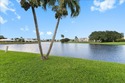 WATERFRONT GEM! Discover one of the largest villas in the highly for sale in Atlantis Florida Palm Beach County County on GolfHomes.com