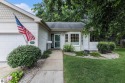 Enjoy easy one-floor living in this beautifully updated for sale in Elk Rapids Michigan Antrim County County on GolfHomes.com