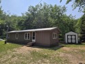 Own Your Up-North Escape! Why rent when you can own this for sale in Mancelona Michigan Antrim County County on GolfHomes.com