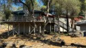Sit back on your deck, high in the trees overlooking the golf for sale in Coarsegold California Madera County County on GolfHomes.com