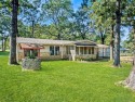 Welcome to lake life in Taylor Ferry! This super quiet for sale in Wagoner Oklahoma Cherokee County County on GolfHomes.com