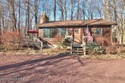 Escape to your own private retreat with LAKE VIEWS in this for sale in Pocono Pines Pennsylvania Monroe County County on GolfHomes.com