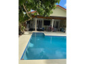 Discover this charming 4-bedroom, 3-bathroom pool home with an for sale in Miami Springs Florida Miami-Dade County County on GolfHomes.com