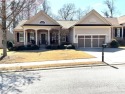 This stunning ranch-style craftsman home is situated on a for sale in Hoschton Georgia Hall County County on GolfHomes.com