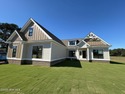 Charming Craftsman in Lockwood Folly! Nestled on a private for sale in Supply North Carolina Brunswick County County on GolfHomes.com