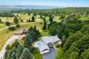 Beautiful view of Crystal Lake from this updated 4 BR home for sale in Beulah Michigan Benzie County County on GolfHomes.com