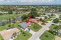 Tropical, lushly landscaped .27 acre lot with tranquil lagoon for sale in Naples Florida Collier County County on GolfHomes.com