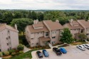 Perched above the third tee of Spruce Run Golf Course, this for sale in Williamsburg Michigan Grand Traverse County County on GolfHomes.com