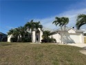 Large 4 bedroom pool home on Coral Oaks Golf Course. Open for sale in Cape Coral Florida Lee County County on GolfHomes.com