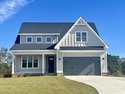 Modern Farmhouse Living Meets Coastal Convenience. A must see for sale in Wallace North Carolina Duplin County County on GolfHomes.com