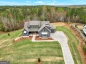 Experience casual living at its finest in this stunning open for sale in Newnan Georgia Coweta County County on GolfHomes.com