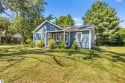 This four bedroom house with a double lot checks all the boxes for sale in Elk Rapids Michigan Antrim County County on GolfHomes.com