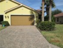 Enjoy the pristine sunset view over the water,  as you relax on for sale in Lehigh Acres Florida Lee County County on GolfHomes.com