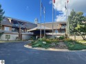 Fully furnished corner unit at the Lodge at Cedar River Village for sale in Bellaire Michigan Antrim County County on GolfHomes.com