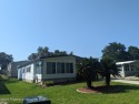 NICE 2 BED, 2 BATH WITH A 1 CAR GARAGE AND A 2 CAR CARPORT IN for sale in Wildwood Florida Sumter County County on GolfHomes.com