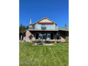 Seller financing available at 6%. Lakefront condo with a boat for sale in Priest Lake Idaho Bonner County County on GolfHomes.com