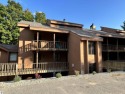 This exceptional three-bedroom, three-and-a-half bathroom condo for sale in Bellaire Michigan Antrim County County on GolfHomes.com