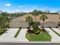 Lakefront 2 bedroom + den, 2 bath attached villa with panoramic for sale in Estero Florida Lee County County on GolfHomes.com