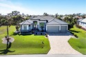 Stunning custom pool home in the desirable Cape Haze Windward for sale in Placida Florida Charlotte County County on GolfHomes.com