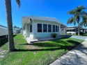 Absolutely NOTHING to be done! Enjoy the Florida retirement for sale in Largo Florida Pinellas County County on GolfHomes.com