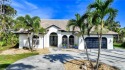This beautiful estate home on more than  1/2  acre is tucked for sale in Punta Gorda Florida Charlotte County County on GolfHomes.com