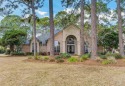 Discover the allure of this stunning single-story custom home for sale in Gulf Breeze Florida Santa Rosa County County on GolfHomes.com