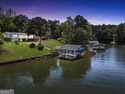 Lakefront Living in Turtle Cove!  Welcome to this stunning for sale in Monticello Georgia Jasper County County on GolfHomes.com