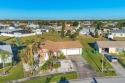 Discover your perfect winter retreat or forever home with this for sale in Port Charlotte Florida Charlotte County County on GolfHomes.com