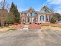 This sophisticated 4-sided brick residence exudes timeless for sale in Cumming Georgia Forsyth County County on GolfHomes.com
