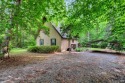 Cute A-frame tucked in the woods at the end of a cul-de-sac for sale in Bracey Virginia Mecklenburg County County on GolfHomes.com