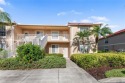 Enjoy this 2 bed+den, 2 bath end unit located on the 2nd floor for sale in Naples Florida Collier County County on GolfHomes.com