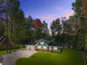 Welcome to 111 Birchwood Drive -- a stunning Lindell cedar home for sale in Cadillac Michigan Wexford County County on GolfHomes.com