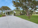 Welcome Home to this charming LAND OWNED 2/2 with a 2020 roof for sale in Port Saint Lucie Florida Saint Lucie County County on GolfHomes.com