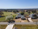 GOLFER'S DREAM HOME overlooking 17th green and pond in Pecan for sale in Granbury Texas Hood County County on GolfHomes.com