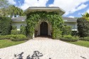 This beautiful courtyard home features four bedrooms for sale in Wellington Florida Palm Beach County County on GolfHomes.com