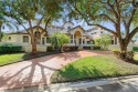 Experience one of Eagle Trace's finest estates! Nearly an acre for sale in Coral Springs Florida Broward County County on GolfHomes.com