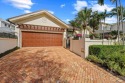 Live The Loxahatchee Club lifestyle in this perfectly and for sale in Jupiter Florida Palm Beach County County on GolfHomes.com