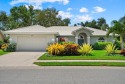 Enjoy stunning lake and golf course views framed by mature trees for sale in Venice Florida Sarasota County County on GolfHomes.com