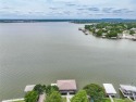 STUNNING WATERFRONT CUSTOM HOME COMPARABLE TO NEW.  Totally for sale in Granbury Texas Hood County County on GolfHomes.com
