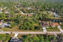 Discover the perfect canvas for your dream home! This waterfront for sale in Port Charlotte Florida Sarasota County County on GolfHomes.com