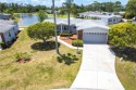 Fantastic sunsets with views of a large lake and the 13th tee!! for sale in North Fort Myers Florida Lee County County on GolfHomes.com